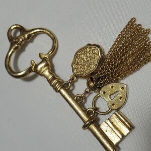 Gold Key Brooch with Ornate Charms